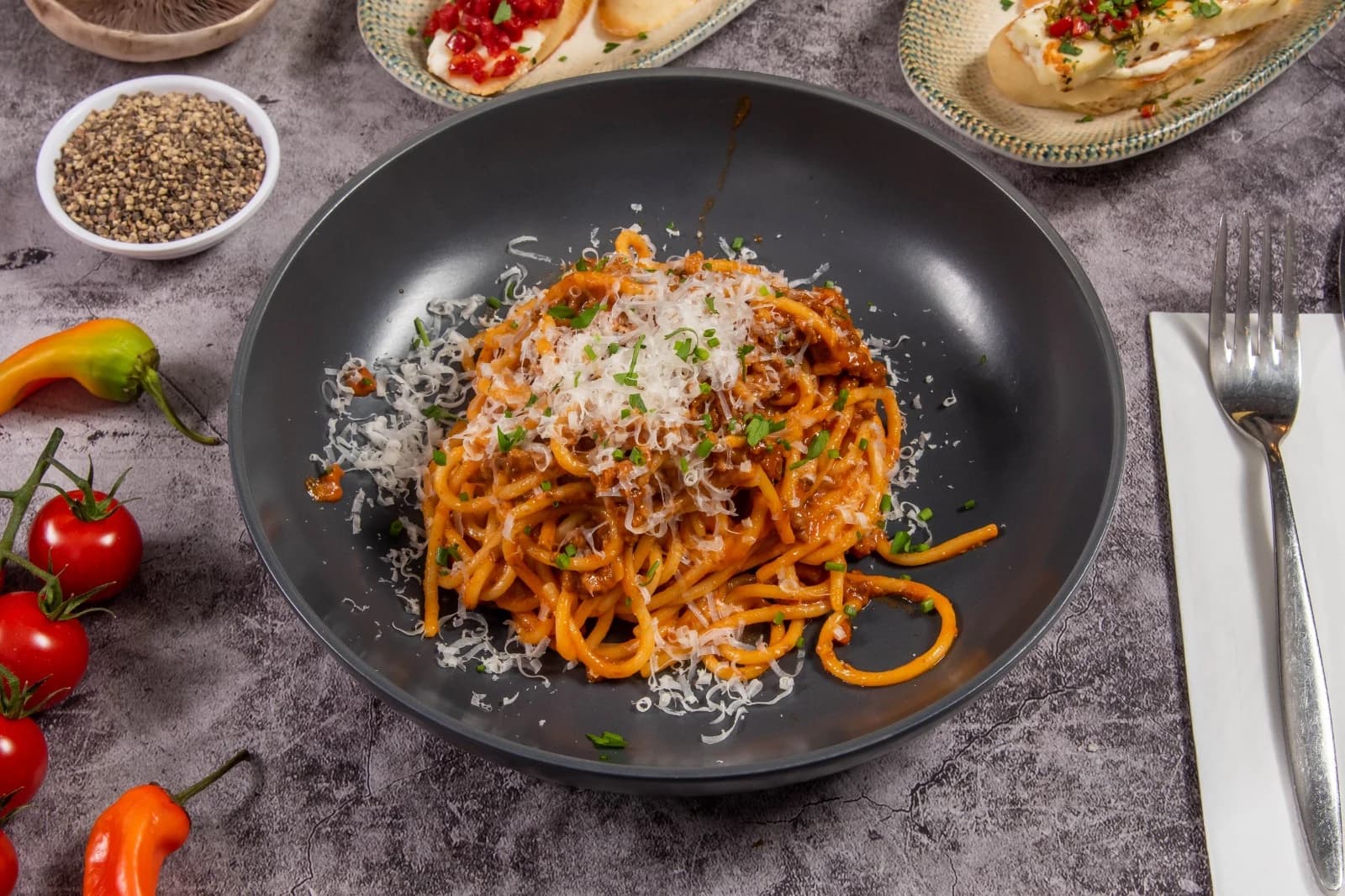 Spaghetti Bolognese with grated cheese